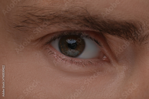 Evil eye. Man with scary eyes, closeup view