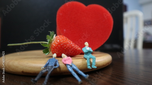 Tableau sur toile people with red heat and strawberry design for story and connotation concept