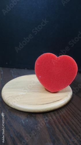 wooden board with red heart and strawberry design for love and romantic concept