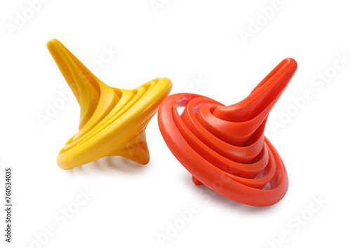 Two colorful spinning tops on white background © New Africa