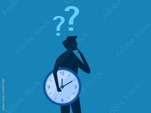 Think and reflect on the time. Businessman holding time thinking about clock