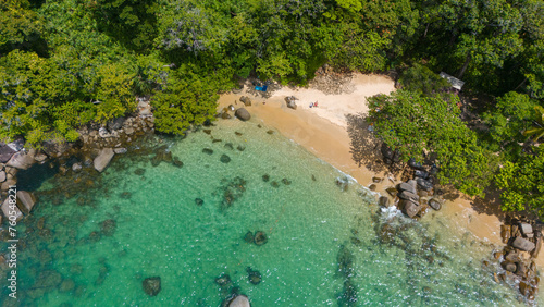 Aerial view of a small sandy tropical beach and shallow ocean. Small Sandy Beach at Lam Ru national park in Khao Lak, Thailand. 