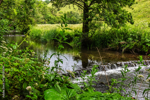 The River Dove viewed from the path between Dovedale and Milldale in the Peak DIstrict in Derbyshire, England photo