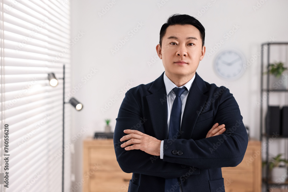 Portrait of confident notary with crossed arms in office, space for text Portrait of confident notary with crossed arms in office, space for text