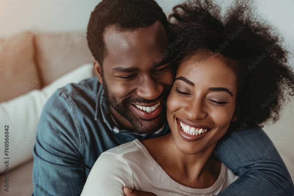 Radiant couple shares a candid laugh, warmth and affection lighting up their intimate embrace Radiant couple shares a candid laugh, warmth and affection lighting up their intimate embrace