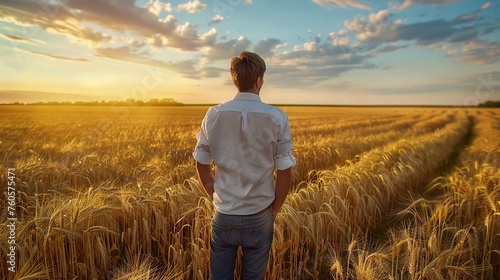 Rear View of Man in Agriculture Field at Sunrise  