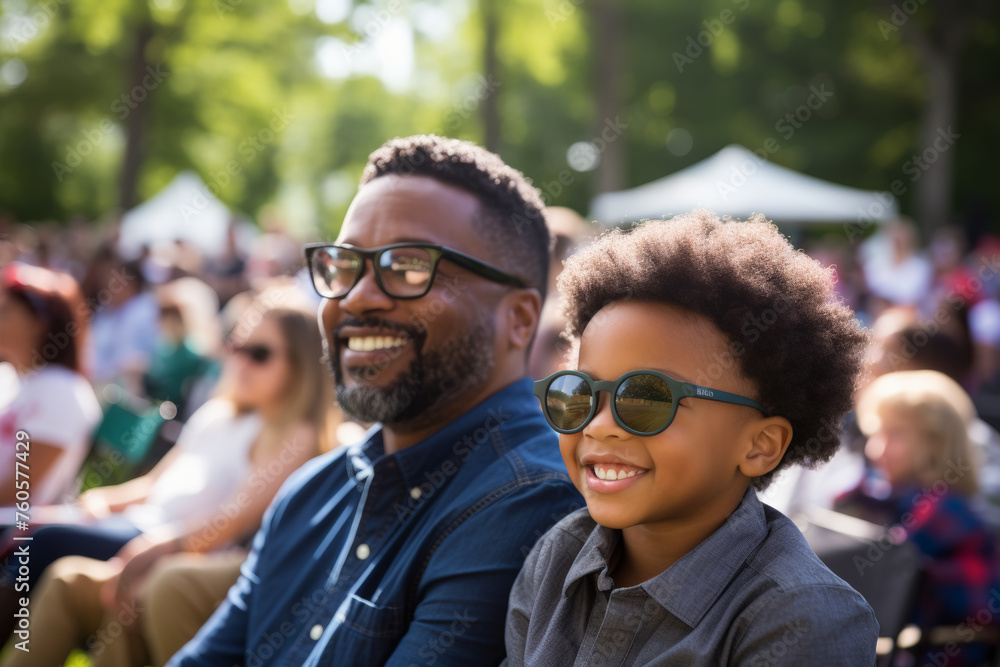 Fototapeta premium Black father and son attending interesting event