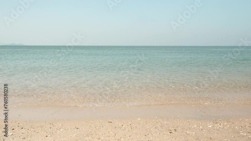 Horizon with sky and white sand tropical.
Wave sea of the on a beach sand background. 