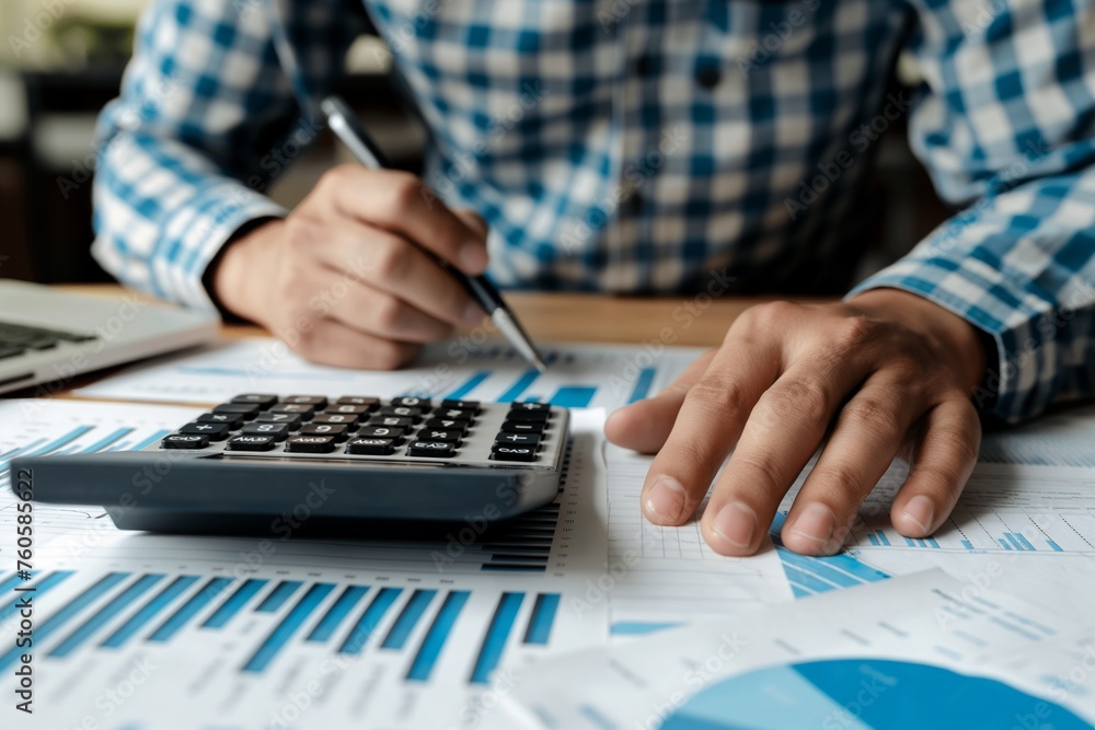 man working on a financial report, a financial report closeup, a man doing financial counting, financial businessman, finance report, a man with financial report and calculator man working on a financial report, a financial report closeup, a man doing financial counting, financial businessman, finance report, a man with financial report and calculator