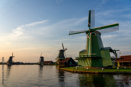 Windmills in the beautiful village of Zaanse Schans in Netherlands at sunset