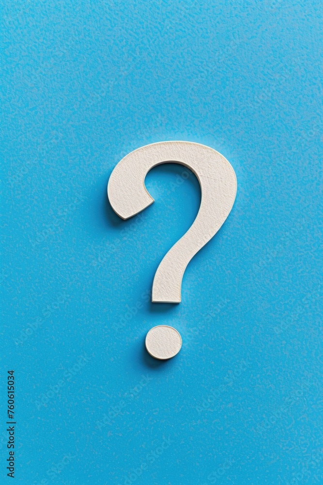 Wooden question mark on blue surface, suitable for educational concepts Wooden question mark on blue surface, suitable for educational concepts