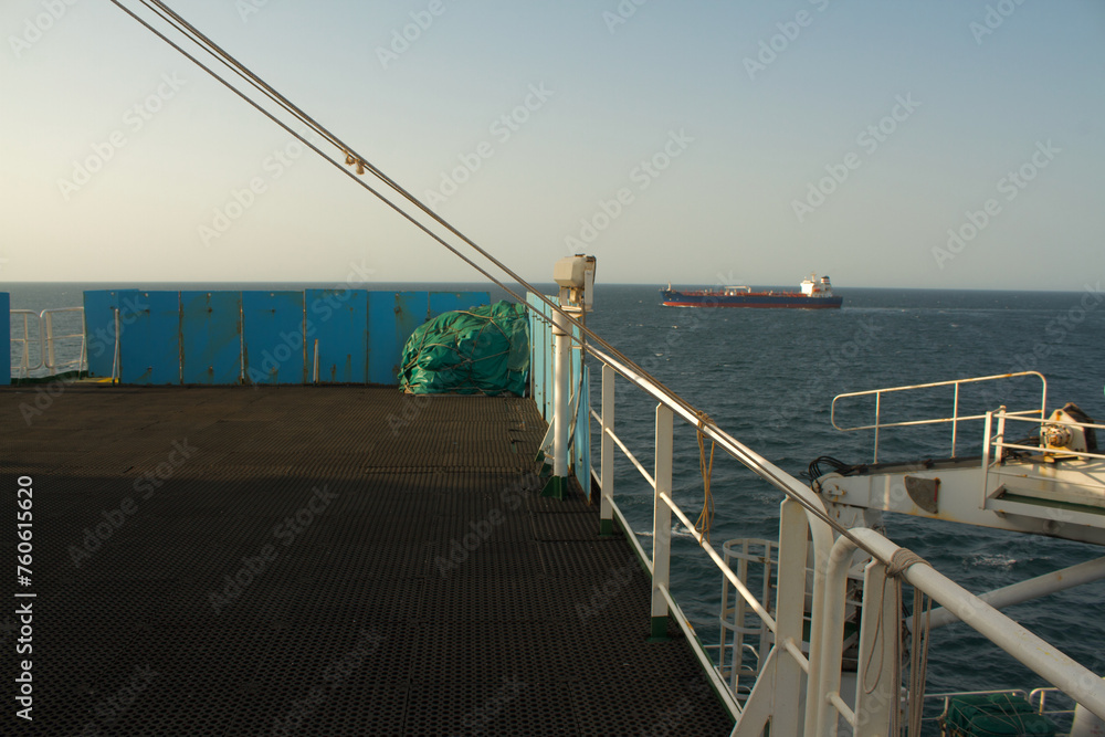 Obraz premium View of the vessel hardening metal plates on the bridge wing of a ship at sea