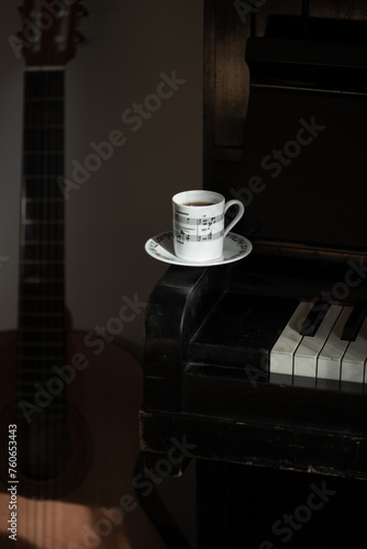 The white coffee cup put on vintage piano key © gertrudda