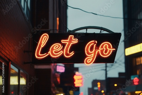 Slogan let go neon light sign text effect on a rainy night street, horizontal composition