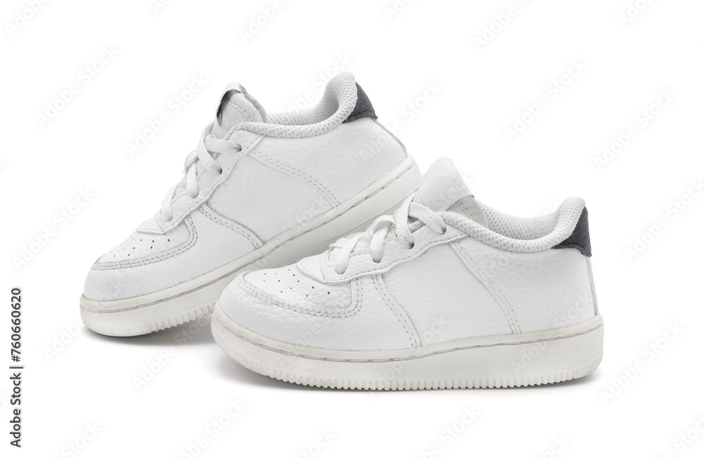New unbranded fashion stylish white sport walking kid shoes or sneakers isolated on white background.