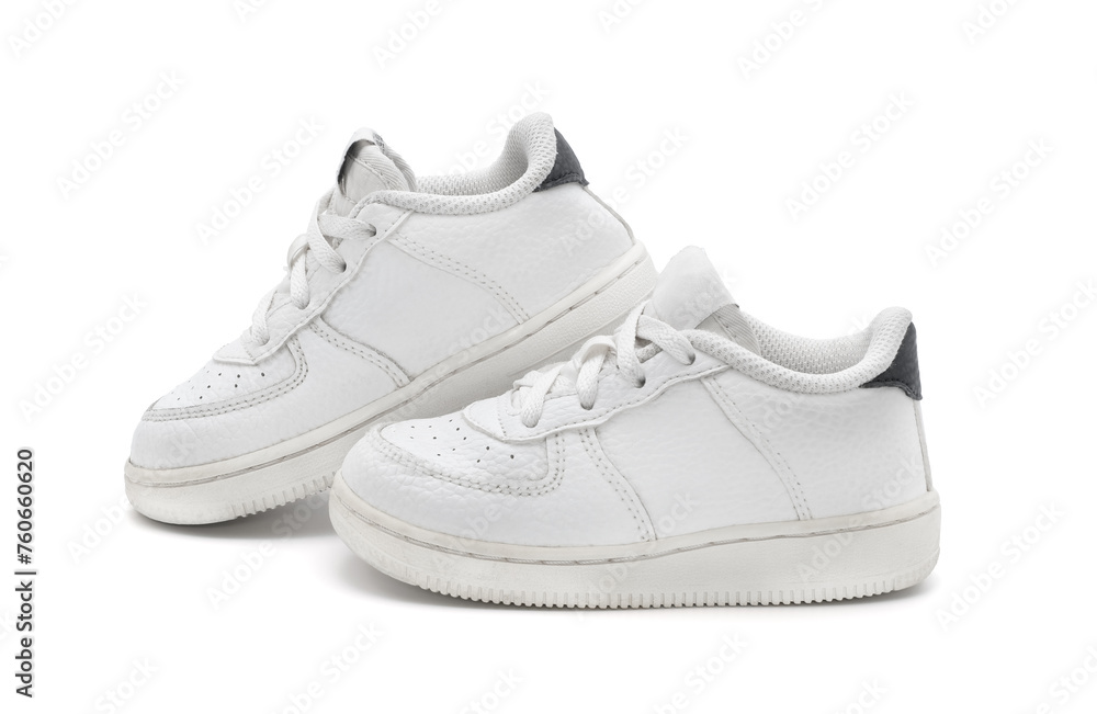 New unbranded fashion stylish white sport walking kid shoes or sneakers isolated on white background. New unbranded fashion stylish white sport walking kid shoes or sneakers isolated on white background.