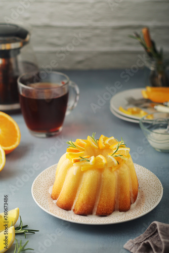 A sweet citrus cake served with oranges and lemons	