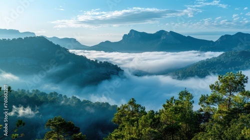  morning mist on a high mountain. It shows a beautiful view of mountains and a sea of mist. presenting beauty miracle and the peace of nature 