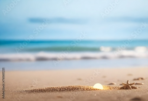 Close-up of sand with a blurred ocean and sunset sky in the background