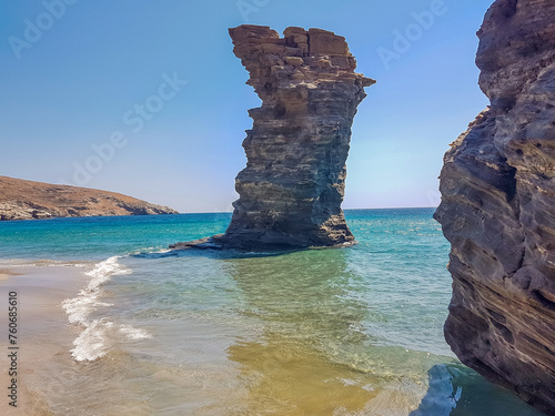 greece andros island beach called tis grias to pidima, rock high in the sea photo