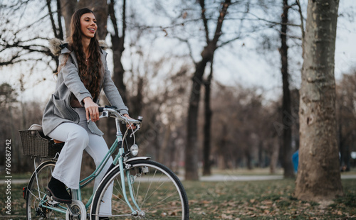 Elegant businesswoman with a stylish bicycle taking a break in a tranquil park setting