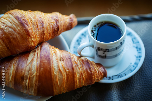 Cup of coffee with two croissants © gertrudda