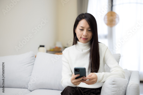 Woman use mobile phone at home