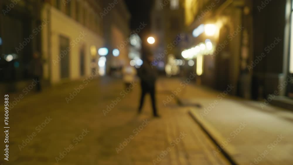 Urban Nightlife: Blurry 4K Video Capturing Pedestrians on City Sidewalk at Night Urban Nightlife: Blurry 4K Video Capturing Pedestrians on City Sidewalk at Night