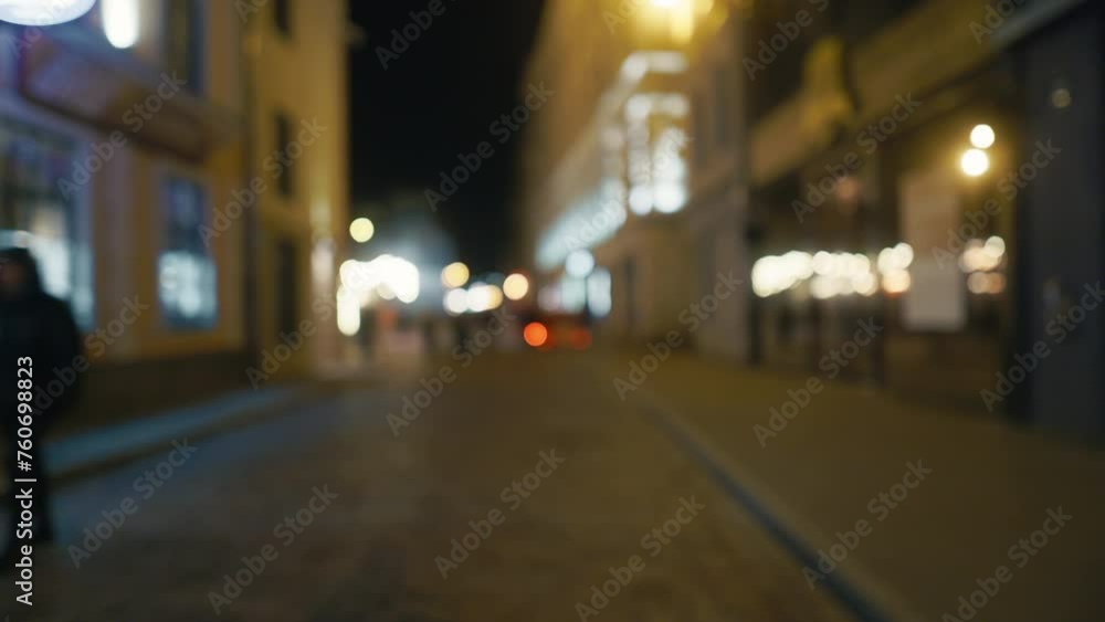 Evening Commute: Blurry 4K Video of Pedestrians on City Sidewalk at Night Evening Commute: Blurry 4K Video of Pedestrians on City Sidewalk at Night