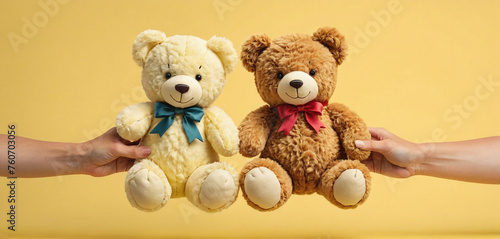 Two hands touching or holding from different sides plush toy to represent parental care and custody