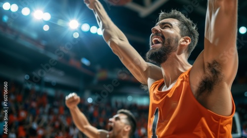 A basketball player celebrates victory, unleashing shouts of joy against the backdrop of a basketball stadium. Emotional celebration of winning the game