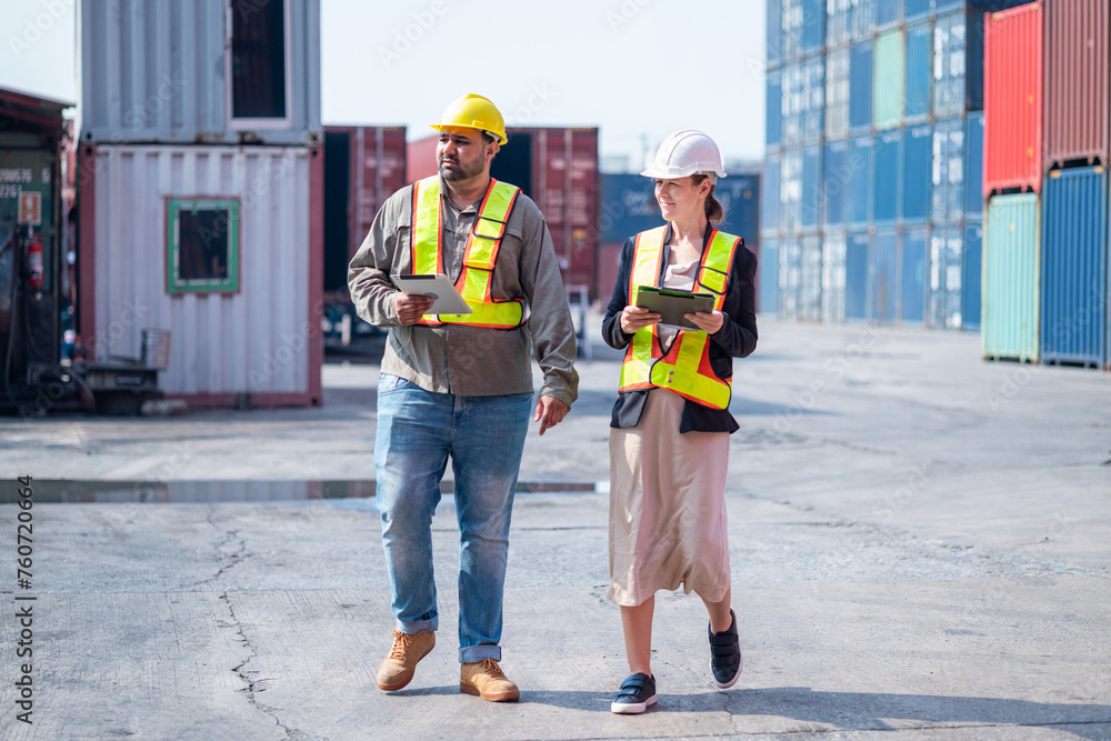 Engineers check the product list before sending it out at the industrial container yard. Engineers check the product list before sending it out at the industrial container yard.