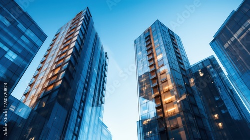 Modern office building with glass facade on a clear sky background. Transparent glass wall of office building.