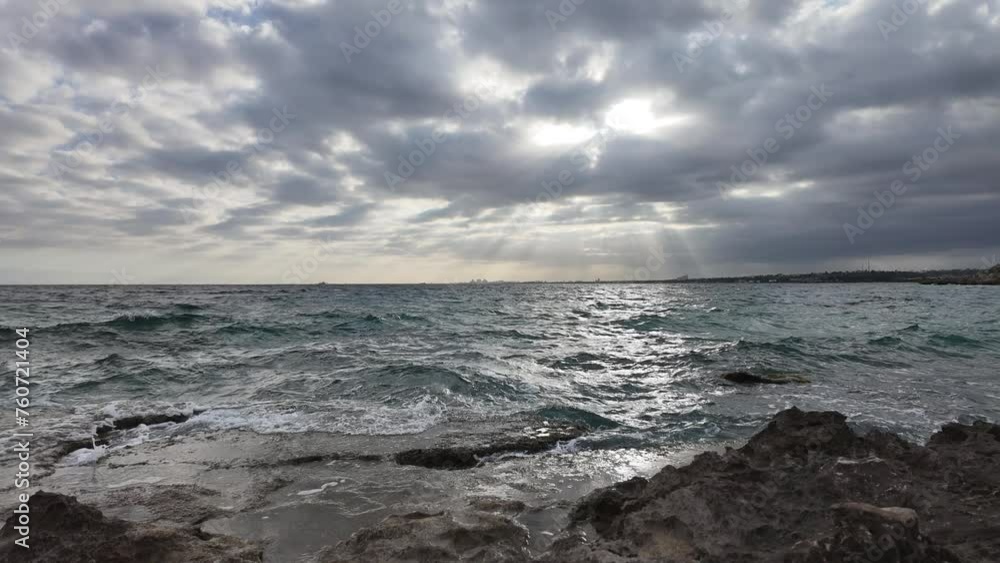 A timelapse of clouds moving over the sea with penetrating sunlight A timelapse of clouds moving over the sea with penetrating sunlight