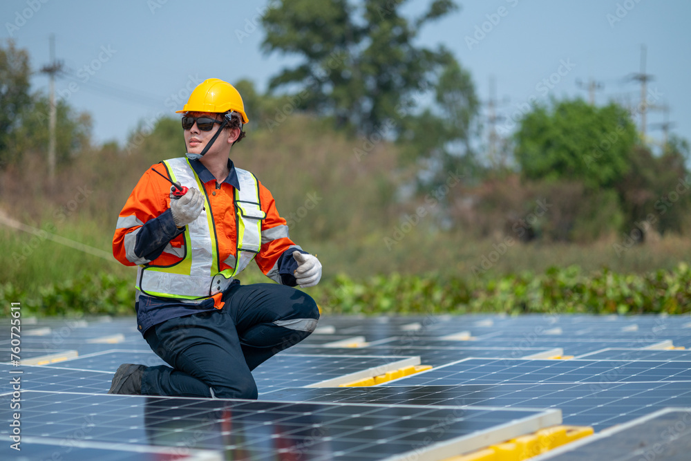 Solar Field Technician Examining Panel Efficiency Solar Field Technician Examining Panel Efficiency
