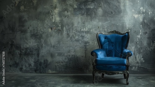 Fashionable designer blue chair on a concrete background. Seating furniture.