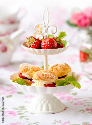 cake with strawberries and cream on a table