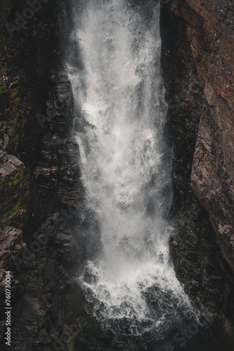 Waterfall landscape in Norway scandinavian nature Sarafossen in Nordreisa travel moody scenery wilderness