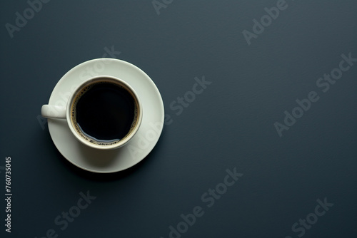Close up of a cup of coffee isolated on the dark blue, minimalist plain background with a lot of space for copy text for writing chalk menu, flat lay composition with copyspace
