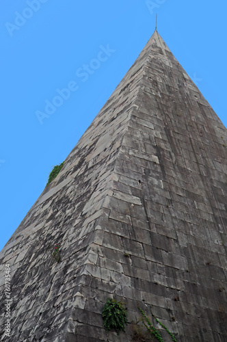 Wallpaper Mural Exterior of the Antique Egyptian Caius Cestius pyramid with blue sky in Testaccio, Rome, Italy Torontodigital.ca