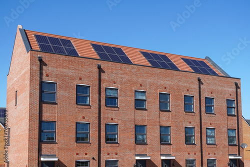 New modern apartment buildings with solar panels on the roof