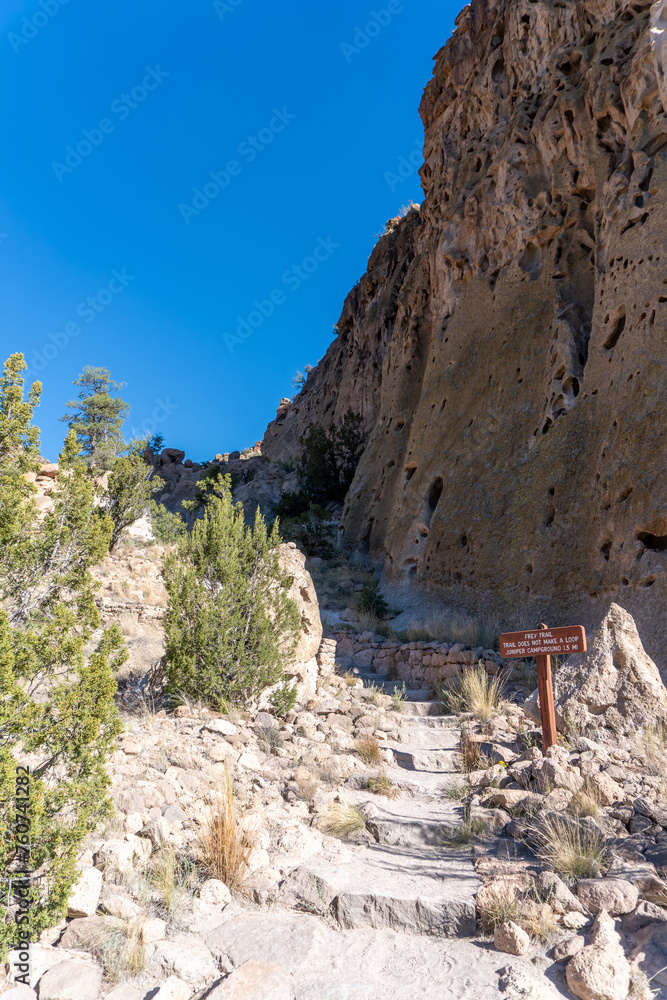 Naklejka premium Bandelier National Monument, New Mexico. Frey Trail was main route to enter and exit Frijoles Canyon before road was built. Trail begins at Juniper Campground then switchbacks down to the canyon floor