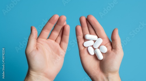 An open hand holds pills