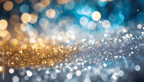background of abstract glitter lights gold blue and silver de focused