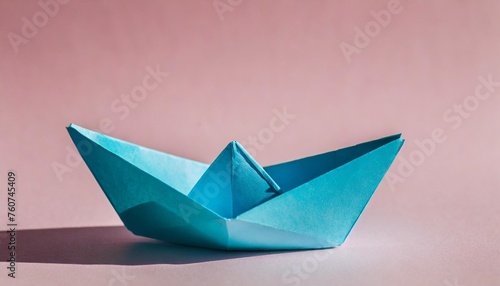 lone paper boat against isolated pastel background copy space