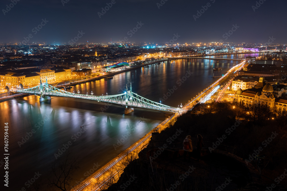 Budapest, Hungary - February 7, 2024: Landscape view of night Budapest from Citadella observation deck. Budapest, Hungary - February 7, 2024: Landscape view of night Budapest from Citadella observation deck.