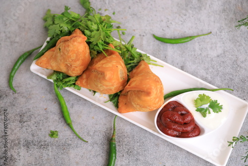 Samosa Indian famous street food snack closeup with selective focus and blur photo