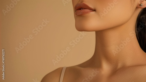 Sensitive female body on a beige background. Women's neck and shoulders © Vladimir