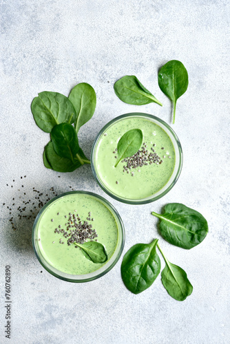 Detox spinach smoothie in a tall glass. Top view with copy space.