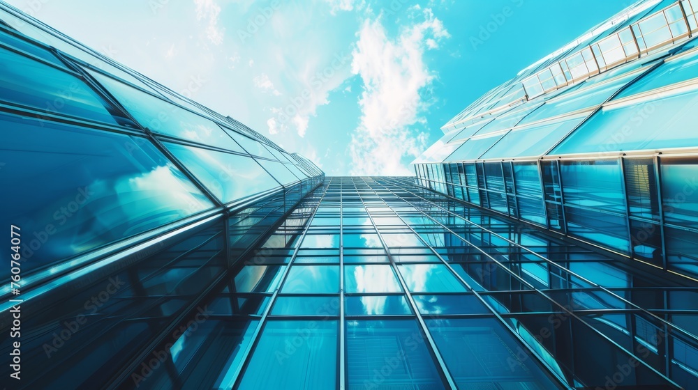 Obraz premium The glass Windows of modern office buildings reflect the blue sky and clouds, symbolizing the transparency of business practices.